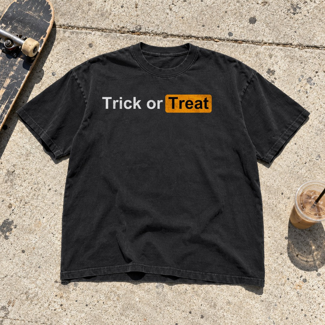 Trick or Treat Shirt laid flat on a sidewalk