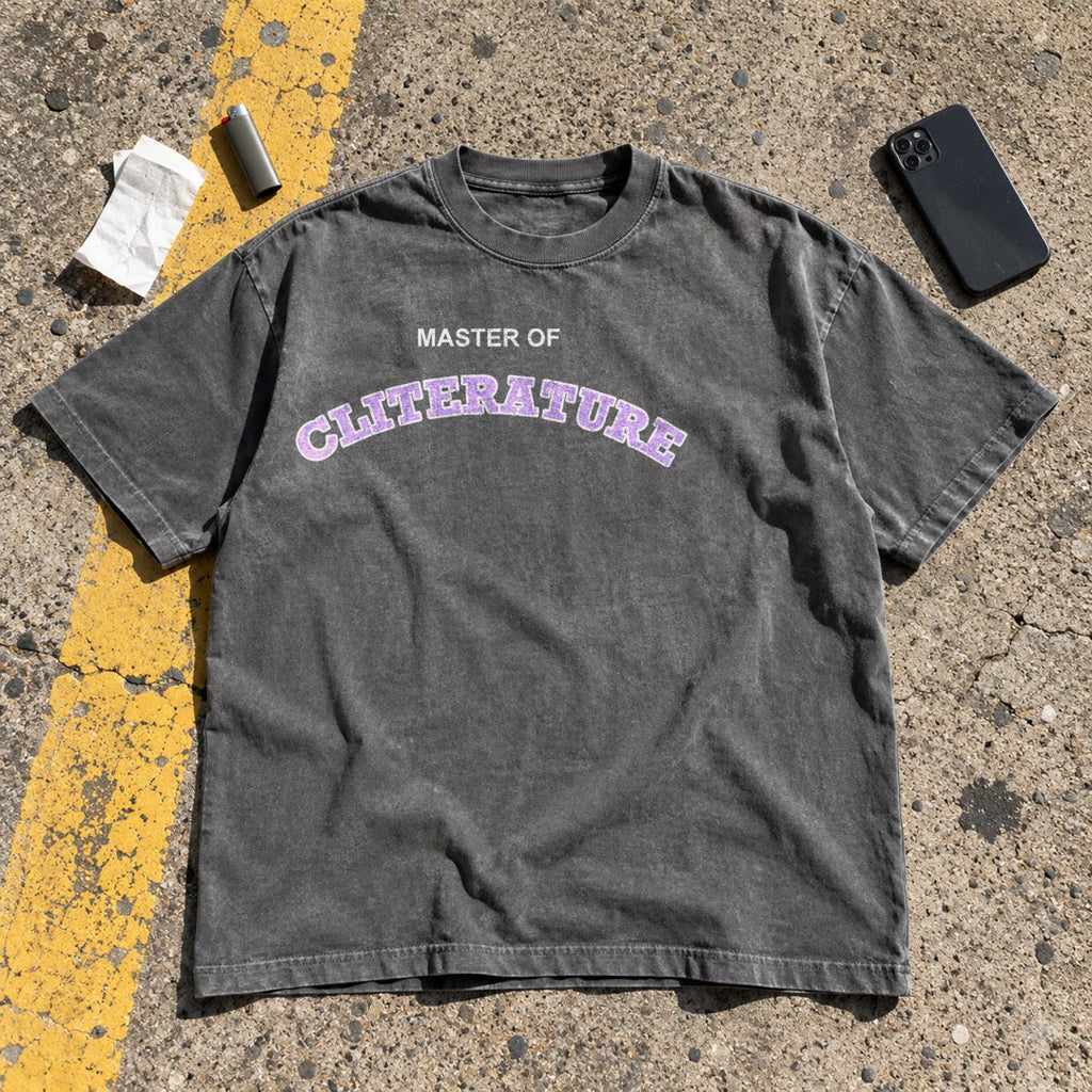 Master of Cliterature Shirt laid flat on a parking lot