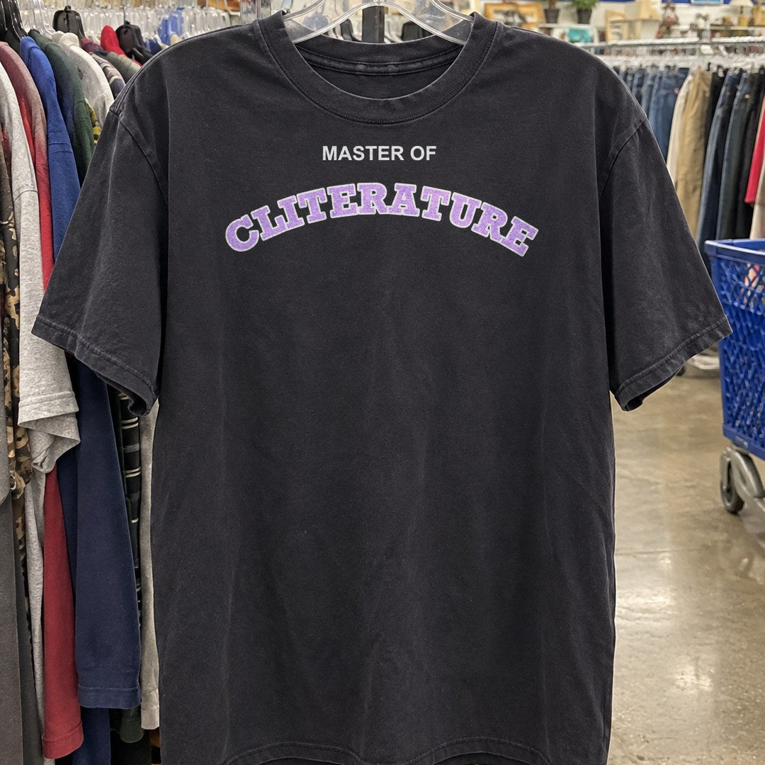 Master of Cliterature Shirt on a thrift store rack