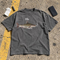 Fih Shirt laid flat on a parking lot