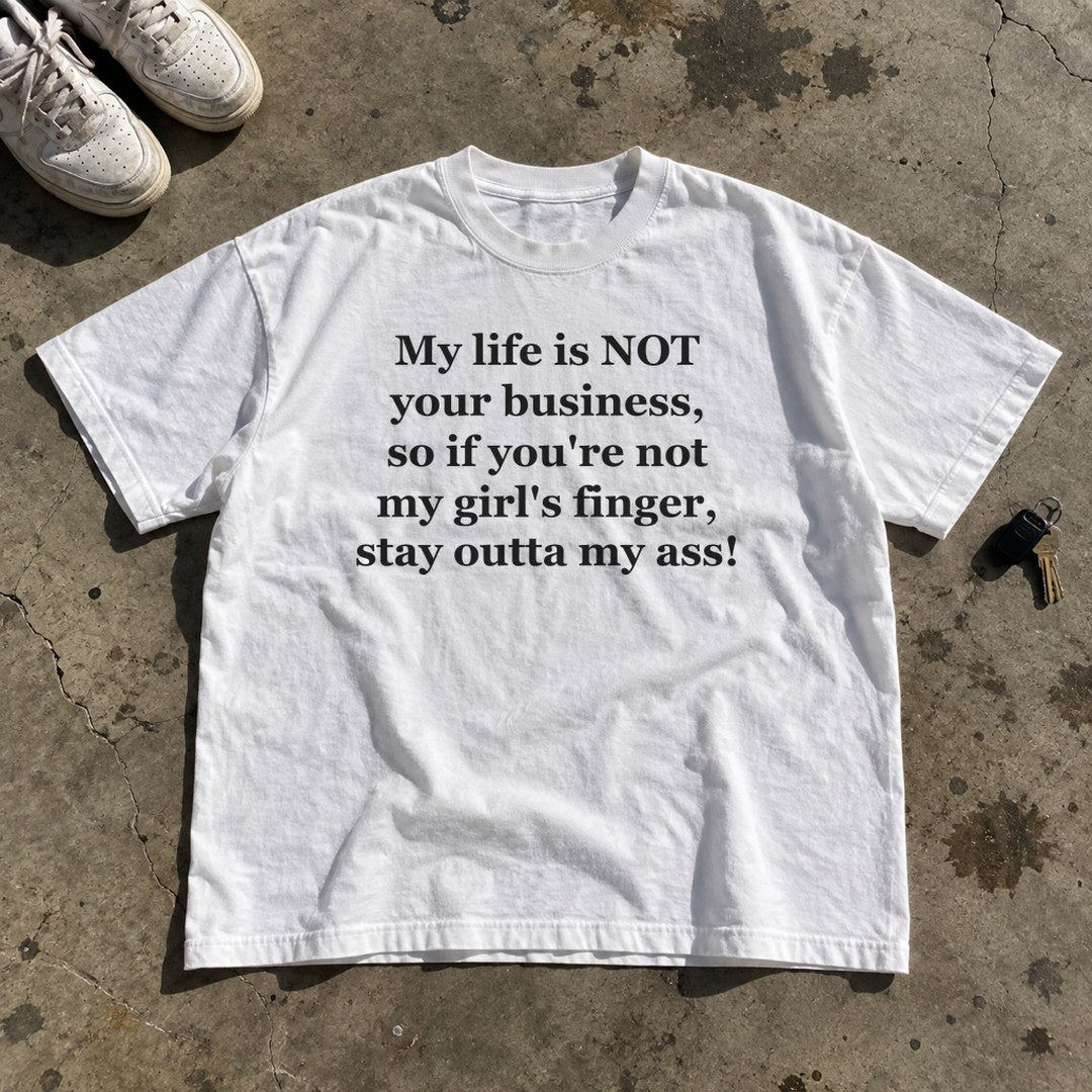 My Life Is Not Your Business Shirt laid flat on a concrete garage floor