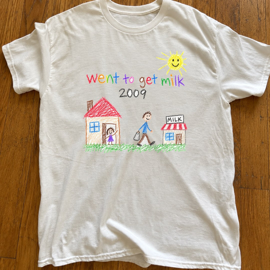 Went To Get Milk 2009 Shirt on a wood floor