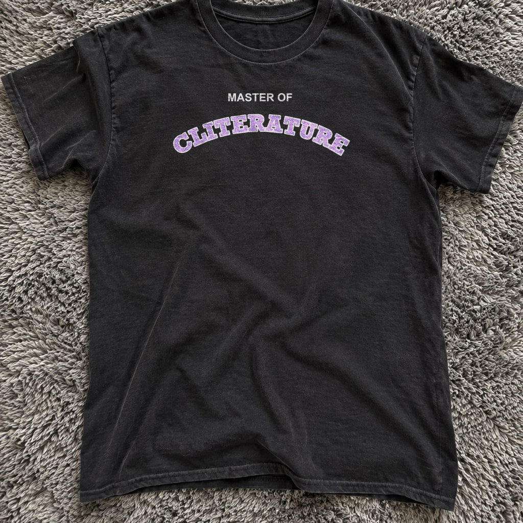 Master of Cliterature Shirt on a shag rug