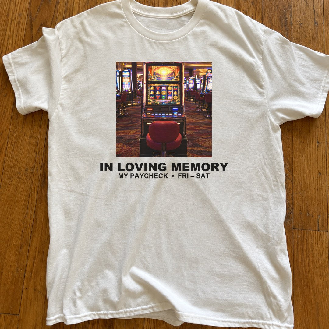 In Loving Memory of My Paycheck Shirt on a wood floor