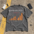 Halloween Candy Dad Tax Shirt laid flat in a parking lot