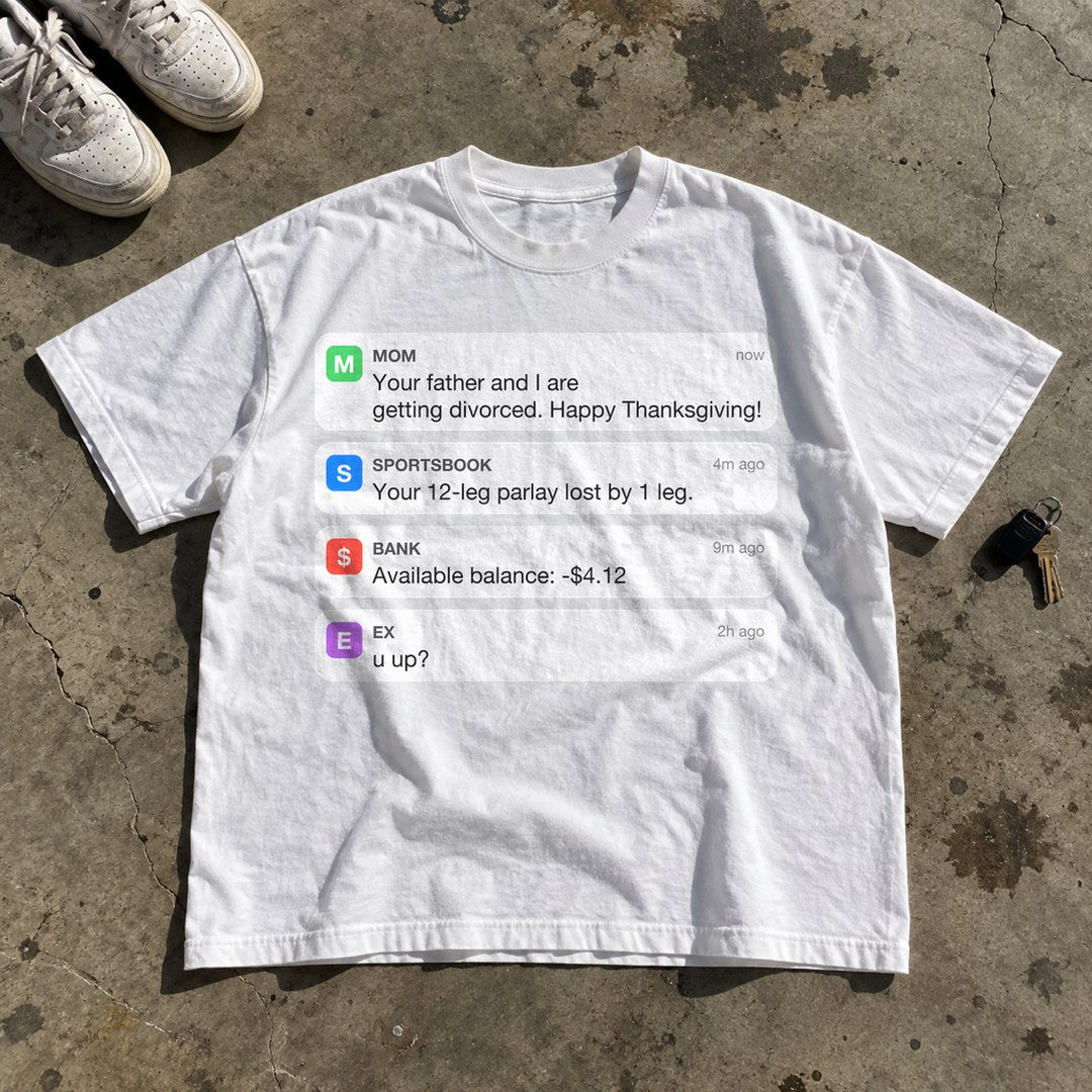 Happy Thanksgiving Notifications Shirt laid flat on a concrete garage floor