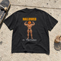 Hallowed Be Thy Gains Shirt laid flat on a sidewalk