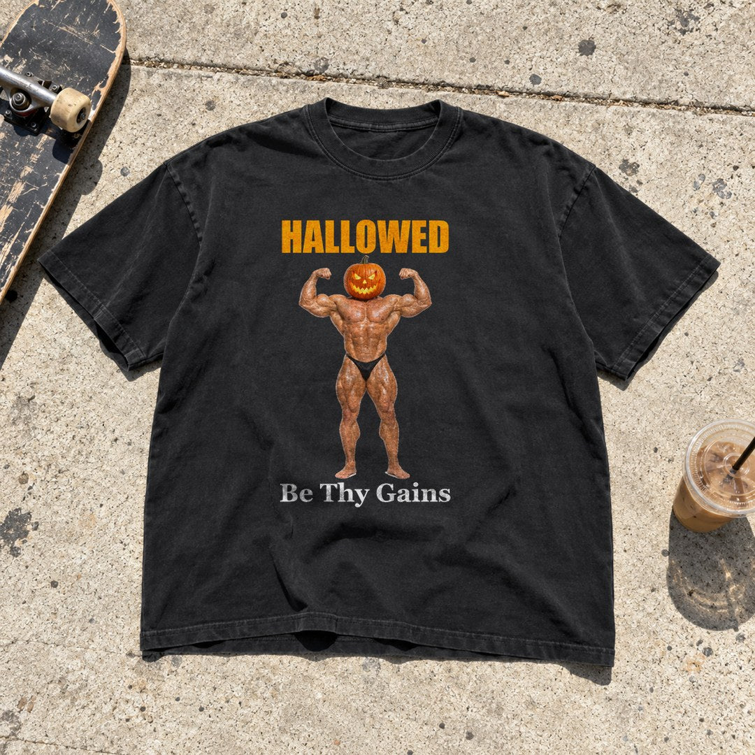 Hallowed Be Thy Gains Shirt laid flat on a sidewalk