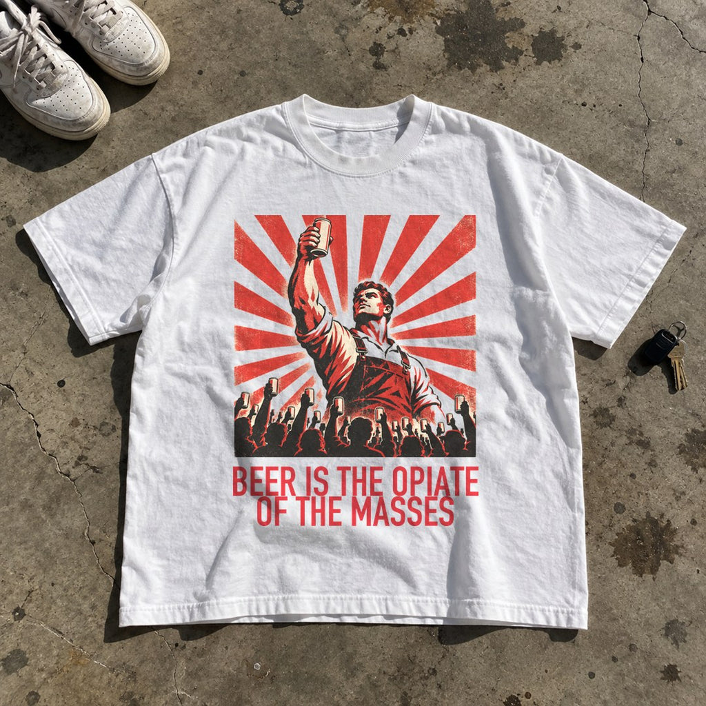 Beer Is the Opiate of the Masses Shirt laid flat on a concrete garage floor