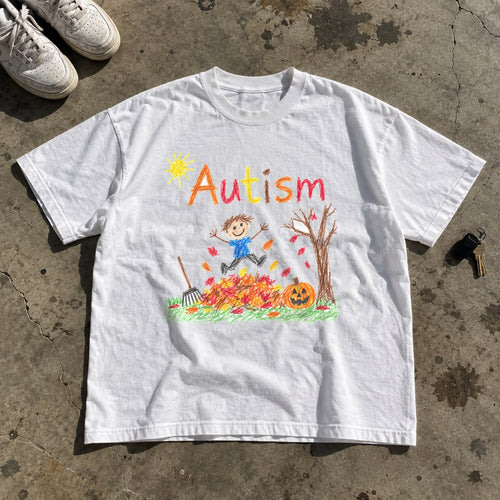 Autism Autumn Shirt laid flat on a concrete garage floor