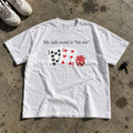 My Safe Word Is Hit Me Shirt laid flat on a concrete garage floor