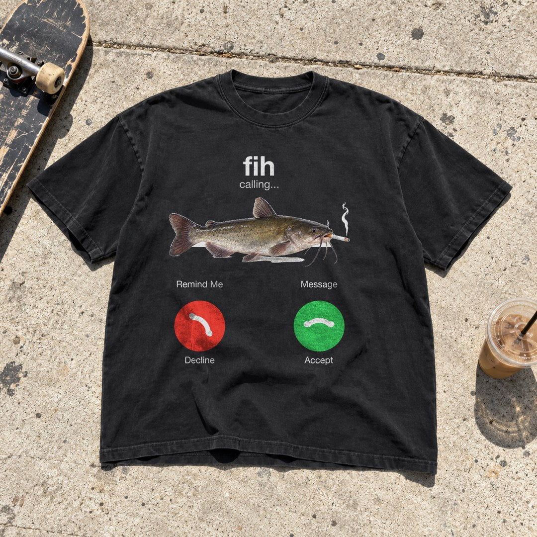 Fih Calling Shirt laid flat on a sidewalk