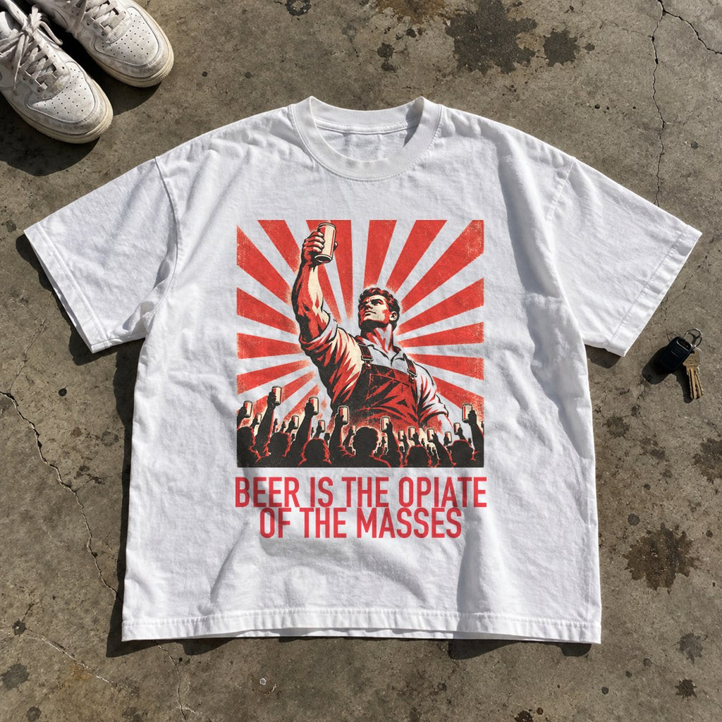 Beer Is the Opiate of the Masses Shirt laid flat on a concrete garage floor